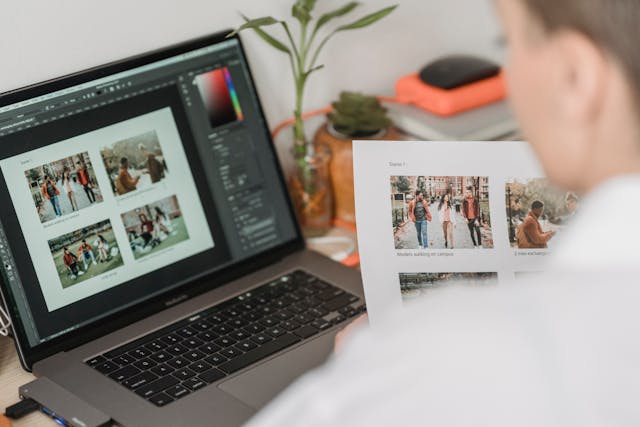 A woman reviewing a photo on his laptop for Employment Verification.